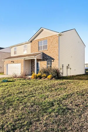 a front view of a house with a yard