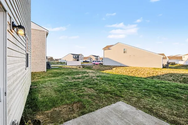 a view of a back yard of the house