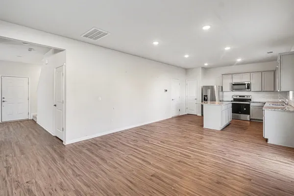 a view of kitchen with wooden floor