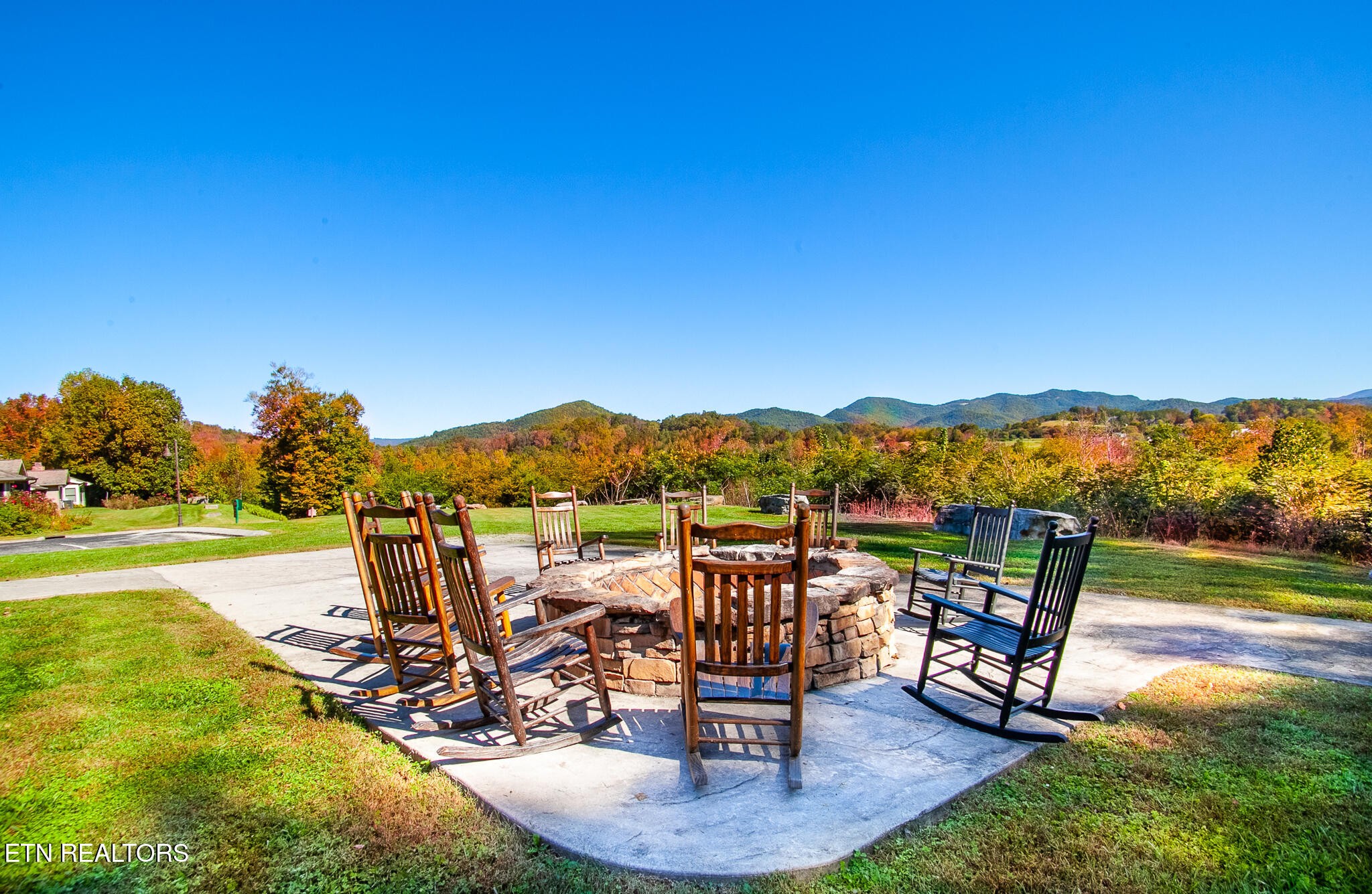 338 Shooting Star Loop, Unit 203 Townsend, TN 37882 - Photo 26 of 30 a view of a chairs and table in patio with a lake view