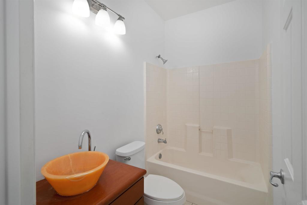1917 Lagrange Road Chula Vista, CA 91913 - Photo 14 of 36 a bathroom with a toilet a sink and bathtub