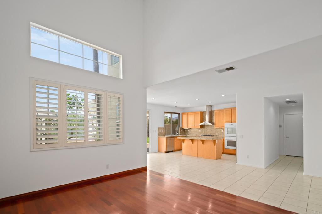 1917 Lagrange Road Chula Vista, CA 91913 - Photo 8 of 36 wooden floor in an empty room with a window and kitchen view