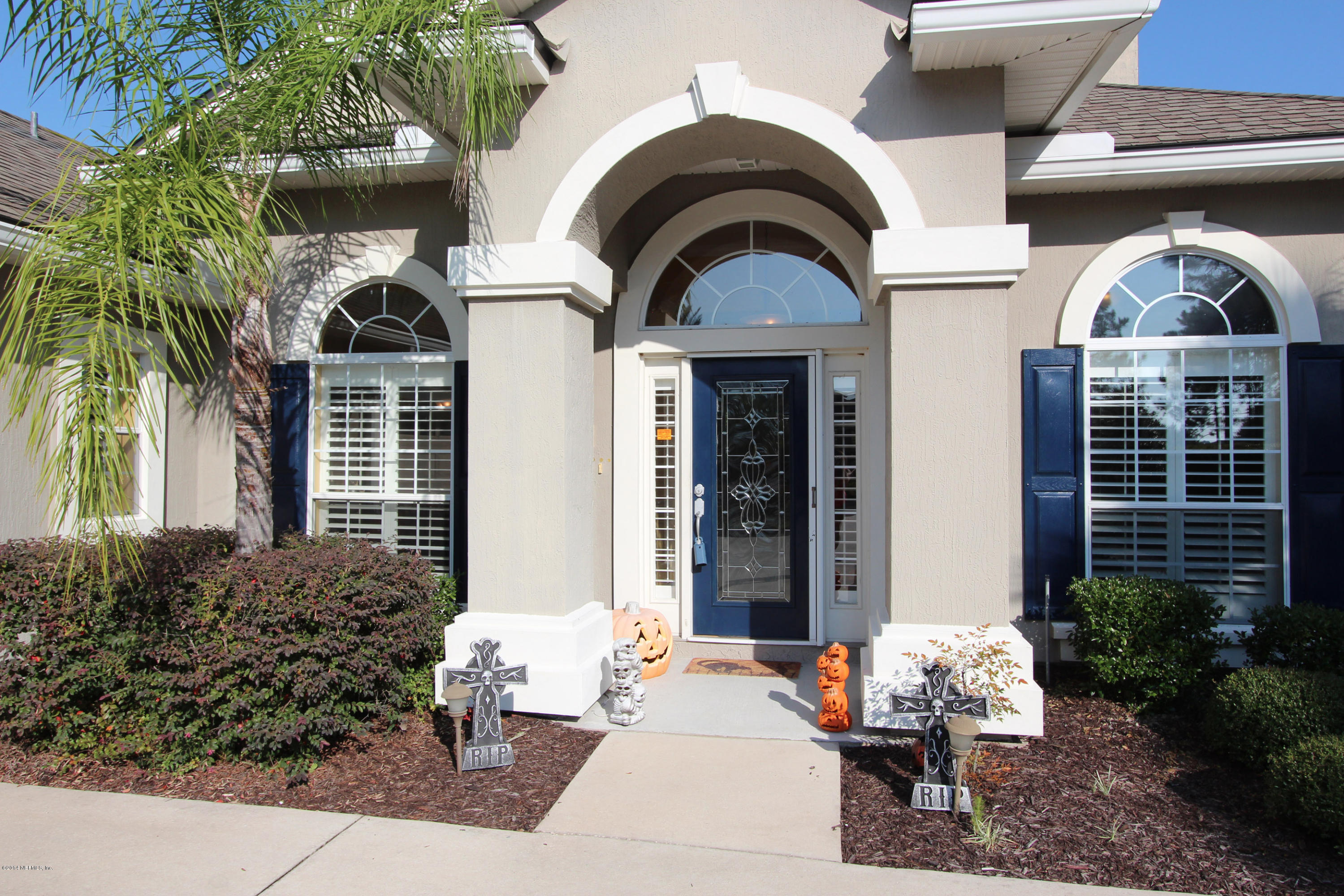 2001 River's Own Road St. Augustine, FL 32092 - Photo 13 of 55 a front view of a house with outdoor seating and plants
