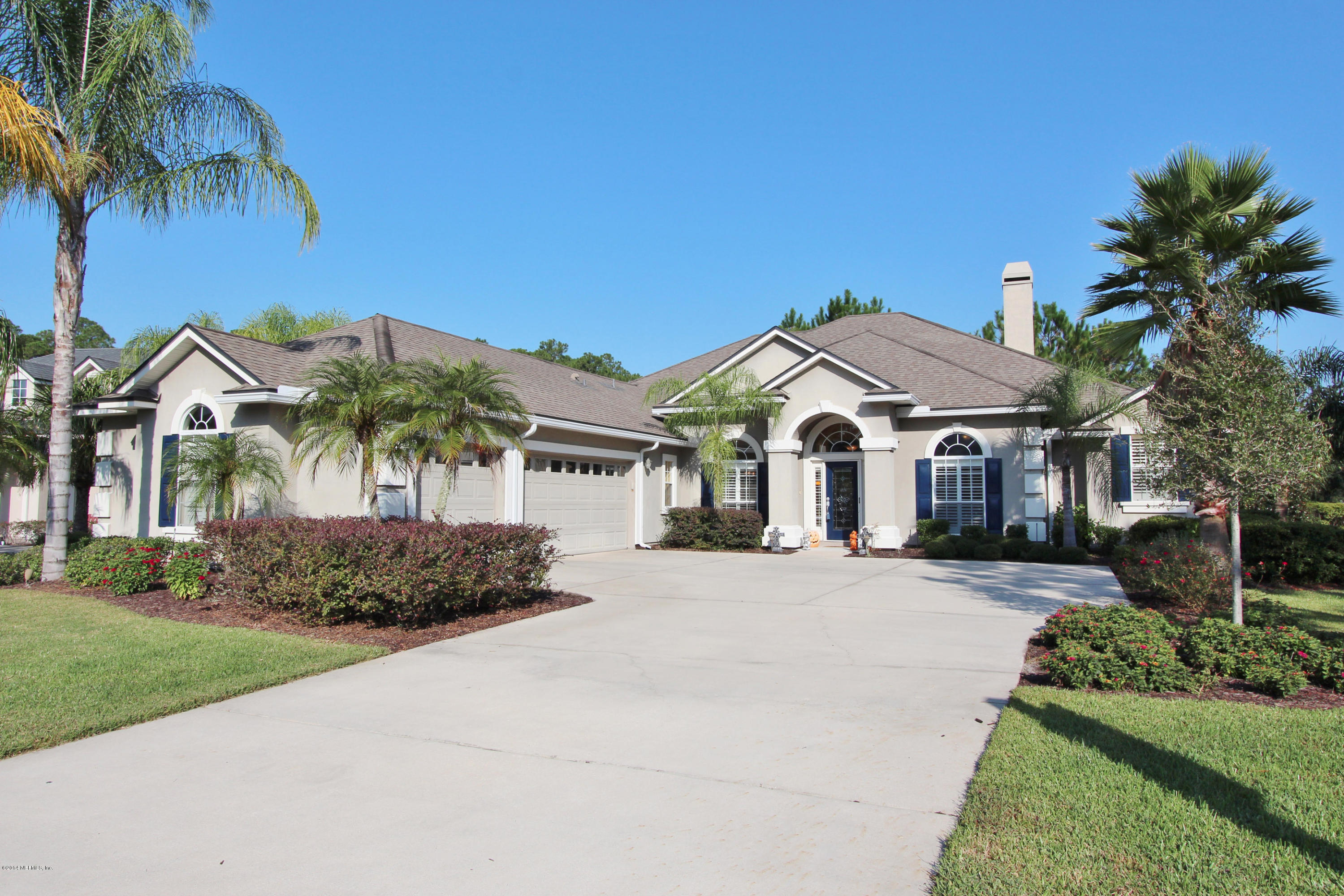 2001 River's Own Road St. Augustine, FL 32092 - Photo 2 of 55 a front view of a house with a garden and trees