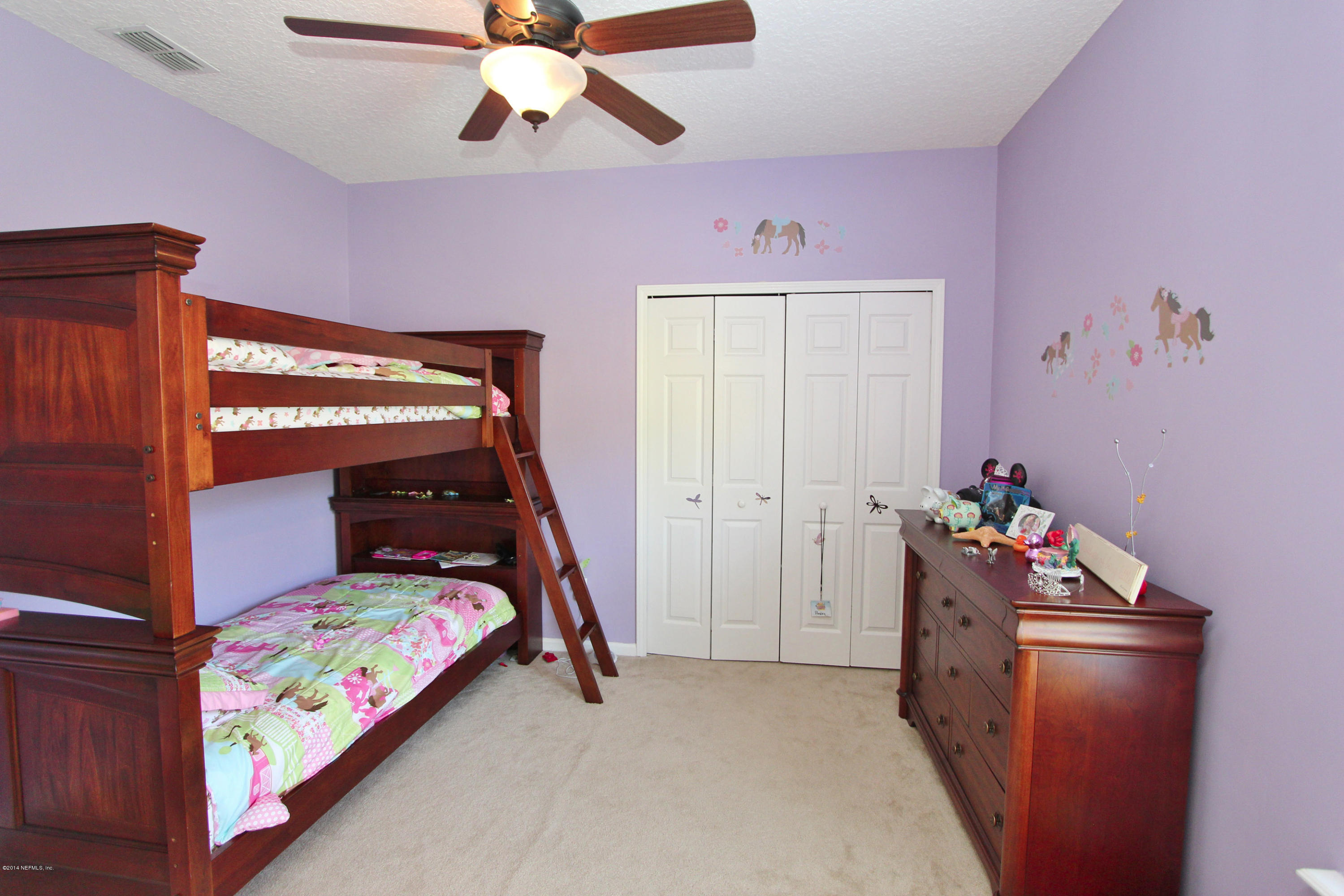 2001 River's Own Road St. Augustine, FL 32092 - Photo 22 of 55 a bed room with a bed and a chandelier