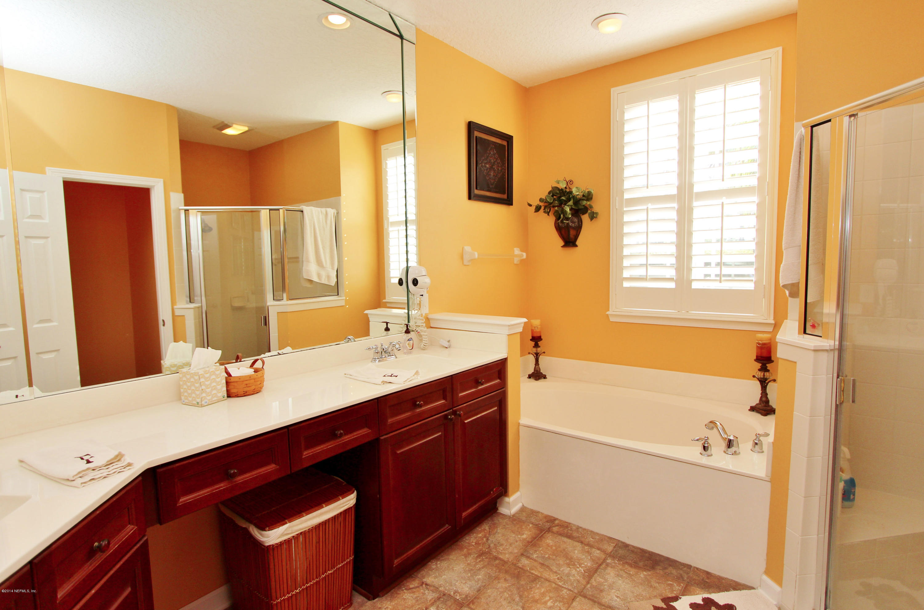 2001 River's Own Road St. Augustine, FL 32092 - Photo 8 of 55 a bathroom with a granite countertop sink and a mirror