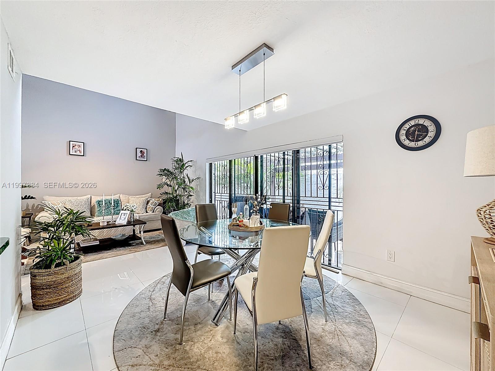 1291 Southwest 124th Court, Unit 19B Miami, FL 33184 - Photo 11 of 33 a view of a dining room with furniture