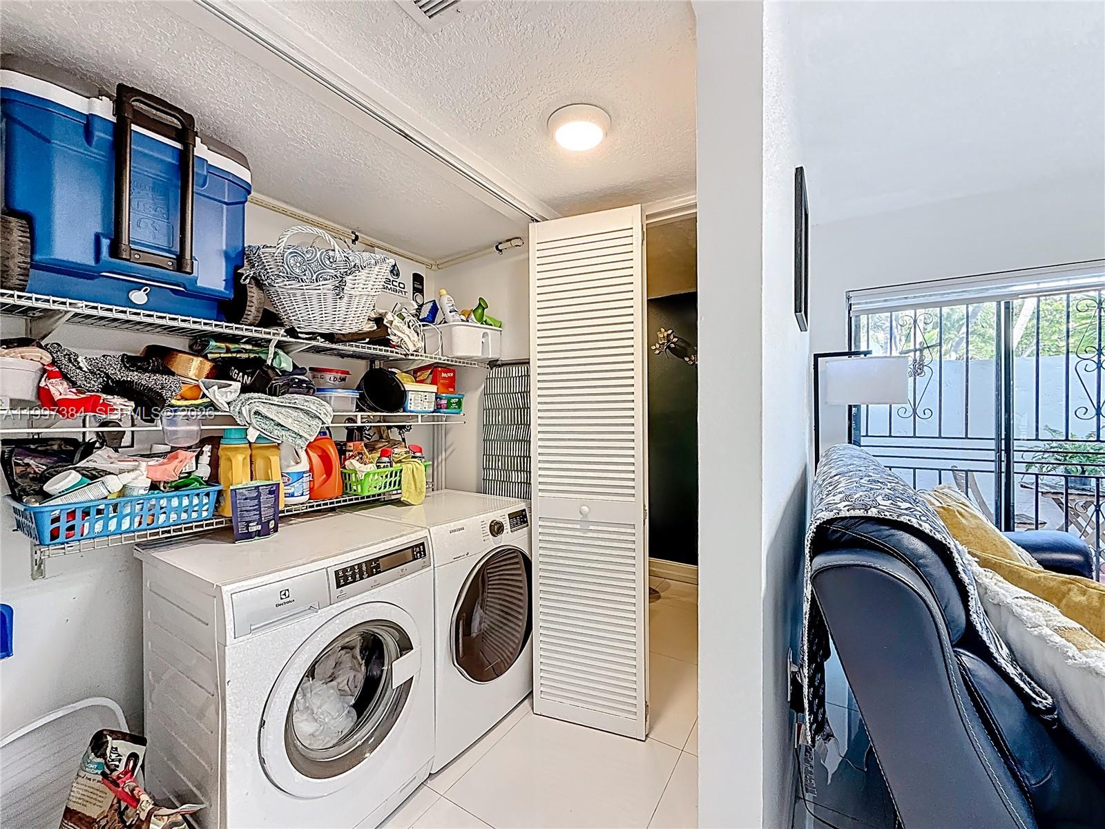 1291 Southwest 124th Court, Unit 19B Miami, FL 33184 - Photo 27 of 33 a view of livingroom with washer and dryer