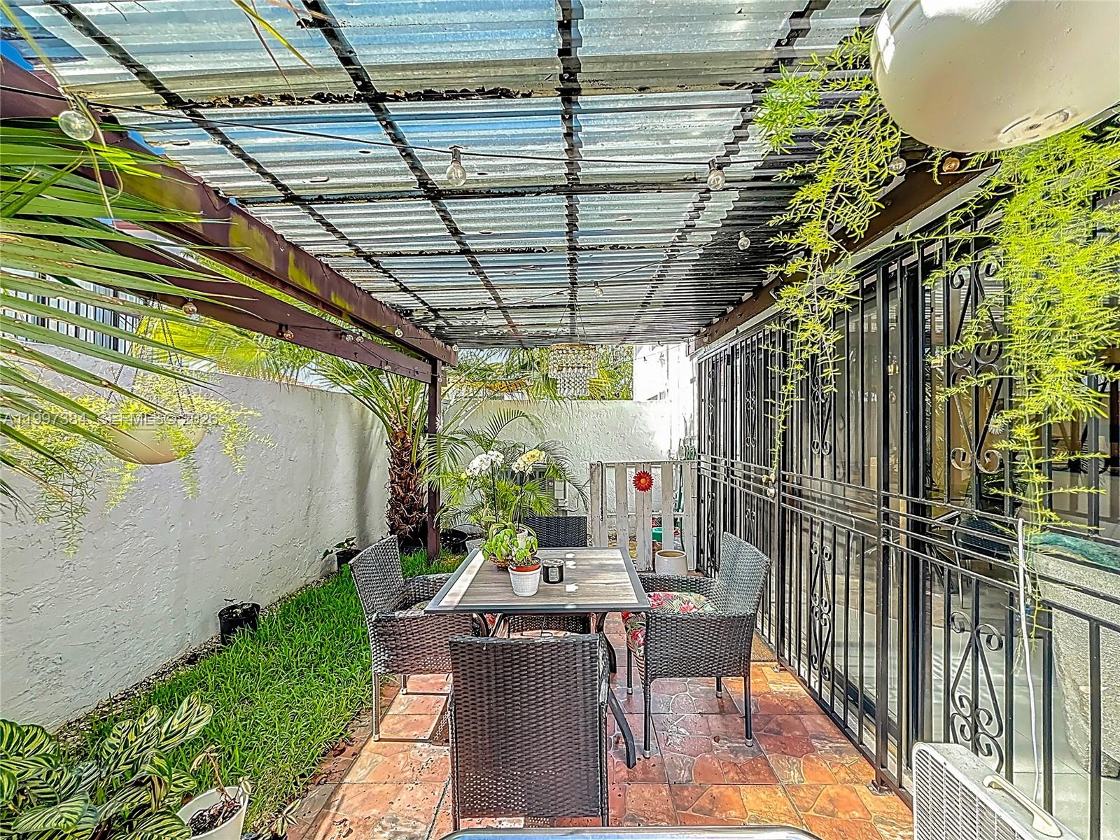 1291 Southwest 124th Court, Unit 19B Miami, FL 33184 - Photo 29 of 33 a view of porch with seating space