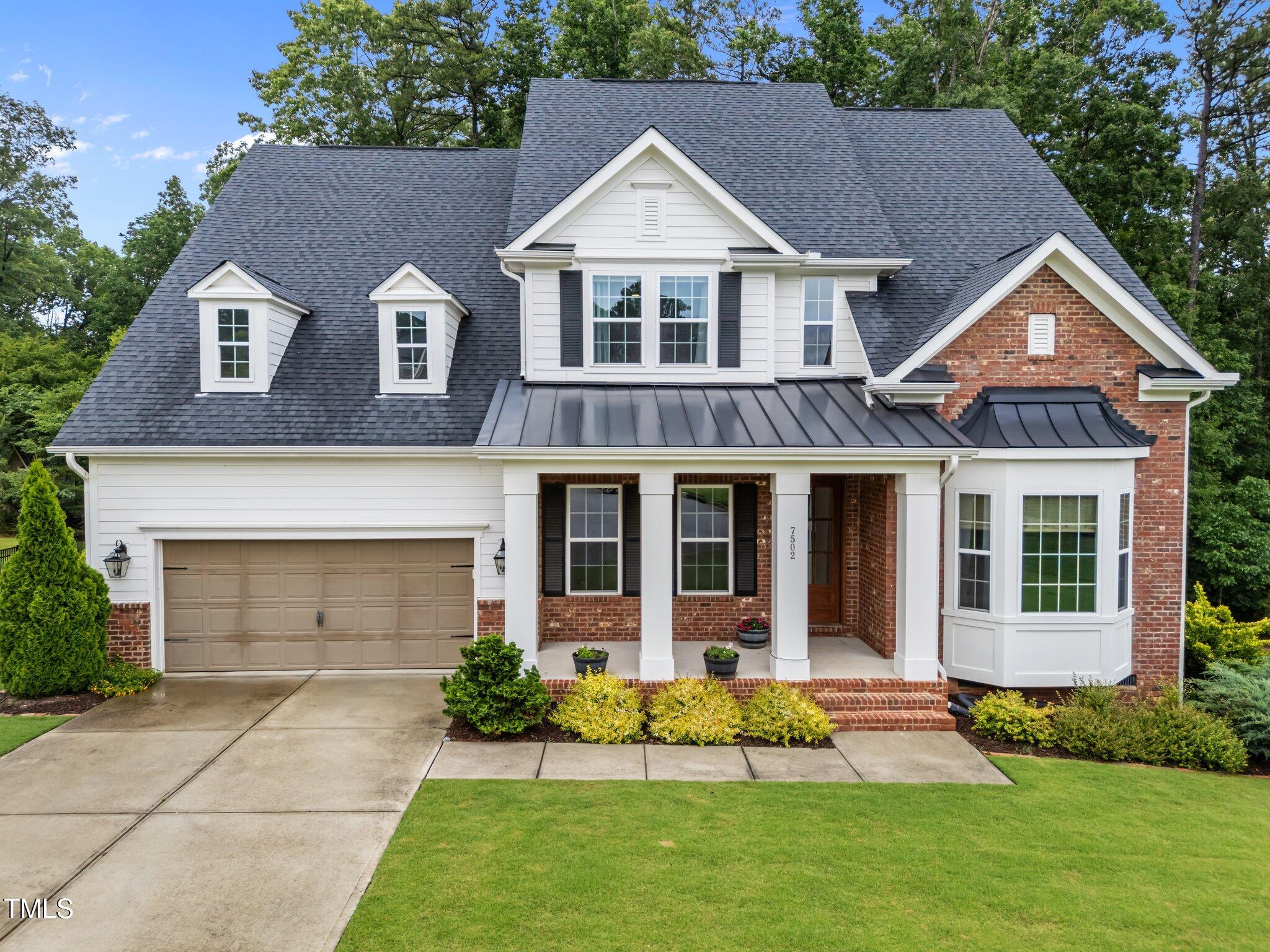 7502 Latteri Court Raleigh, NC 27613 - Photo 1 of 60 a front view of a house with a yard