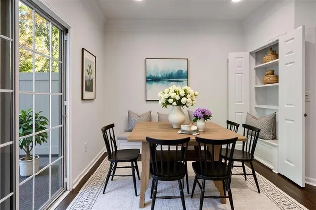 a view of a dining room with furniture window and outside view