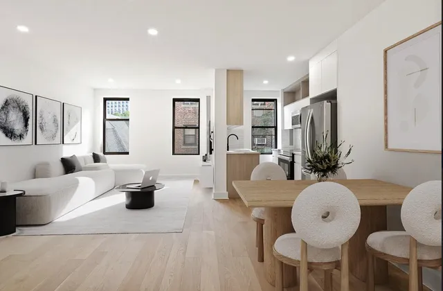a living room with furniture a large window and a chandelier