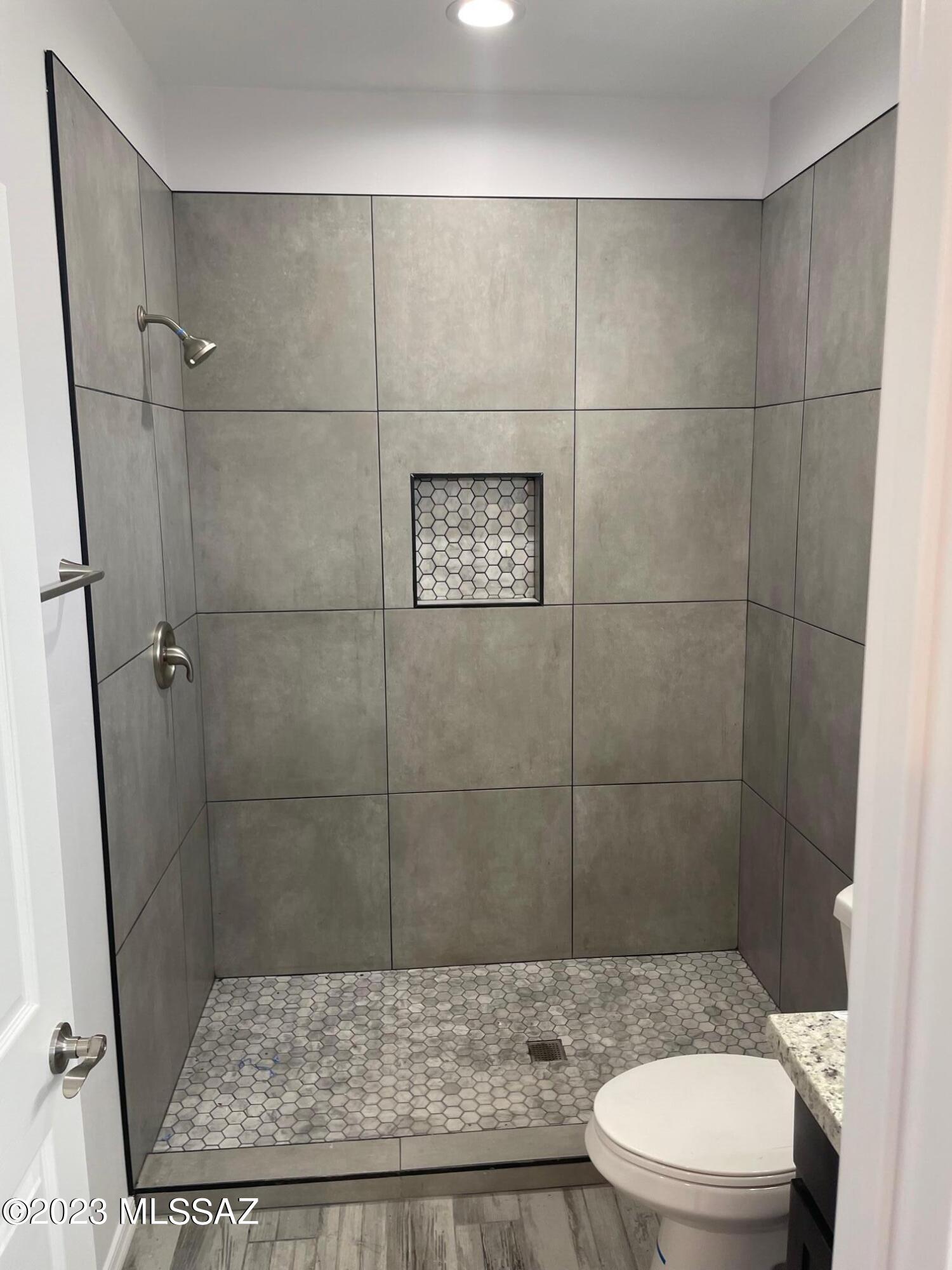 1817 Via Nueva Zelandia Rio Rico, AZ 85648 - Photo 5 of 16 a bathroom with a toilet and a shower