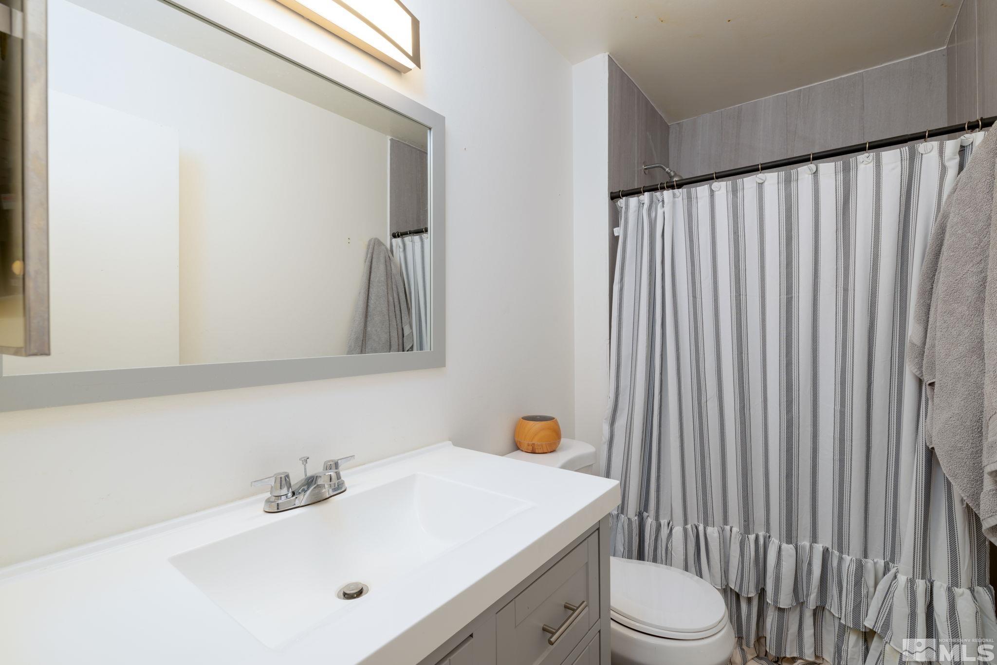2400 Apollo Way Reno, NV 89503 - Photo 17 of 30 a bathroom with a sink toilet and shower