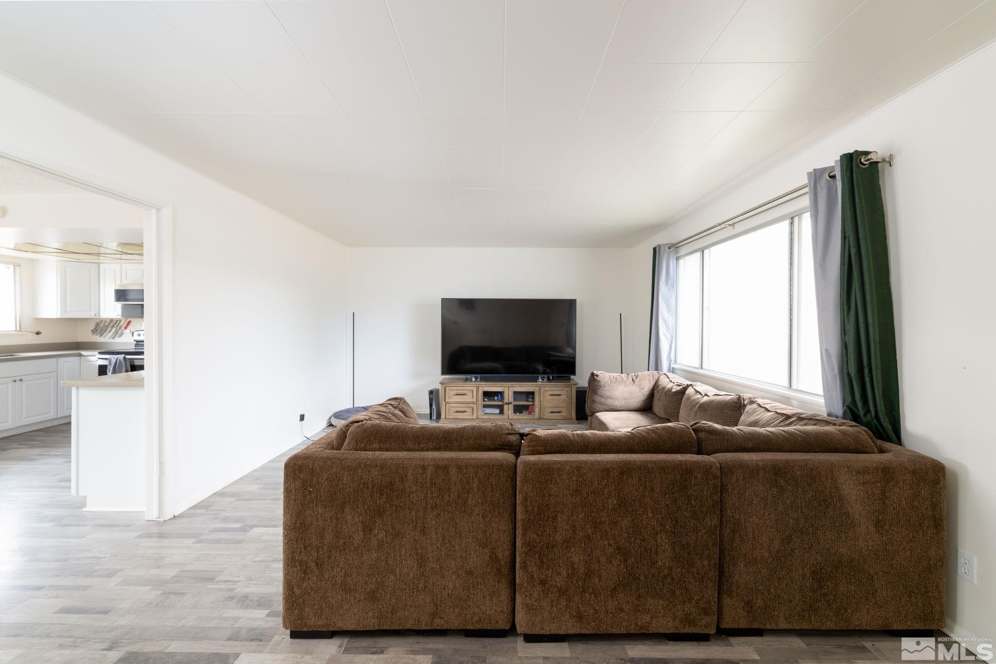 2400 Apollo Way Reno, NV 89503 - Photo 4 of 30 a living room with furniture and a flat screen tv