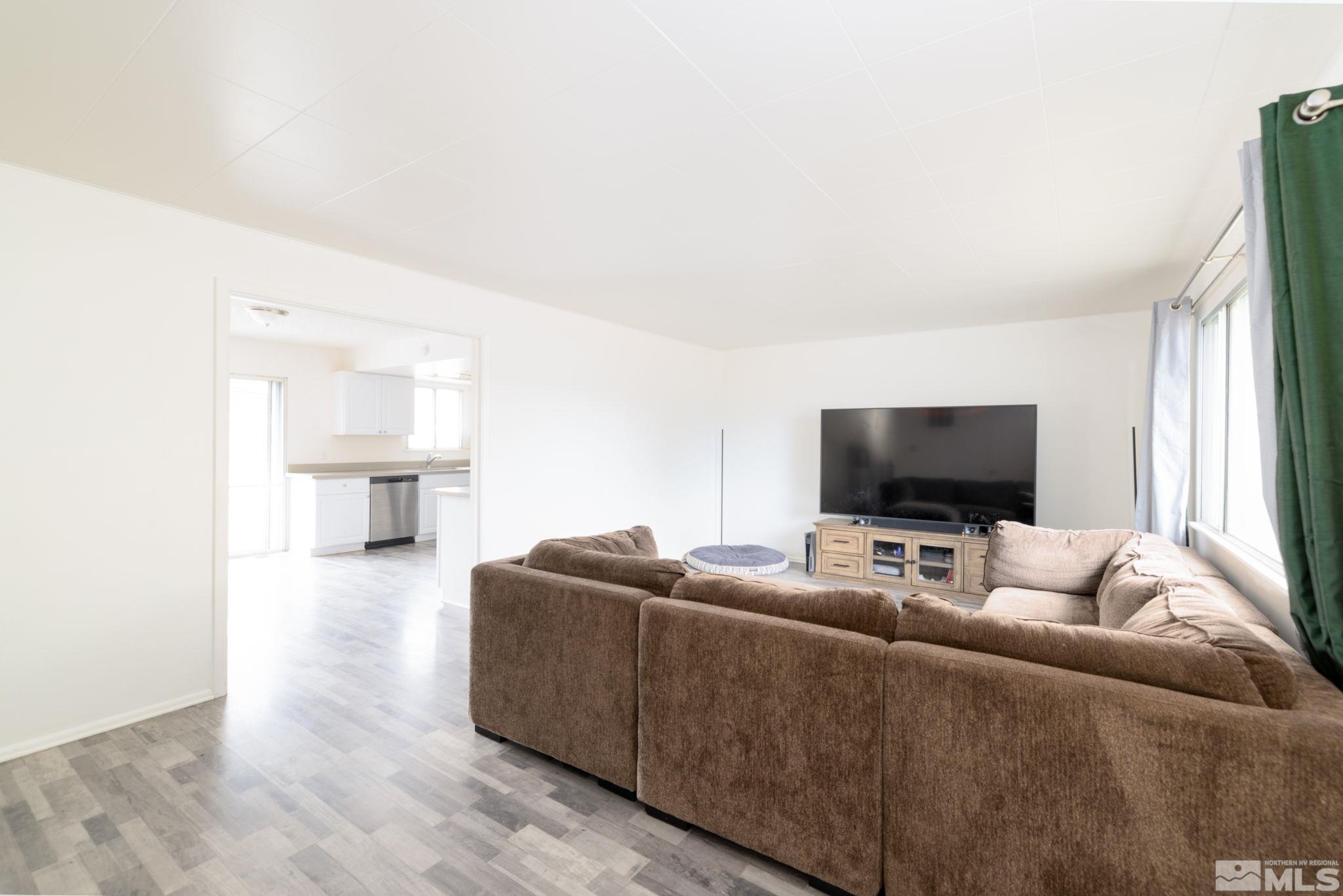 2400 Apollo Way Reno, NV 89503 - Photo 5 of 30 a living room with furniture and a flat screen tv