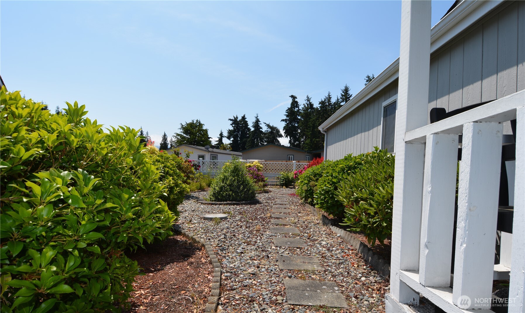20 Brett Circle Sequim, WA 98382 - Photo 25 of 36 a backyard of a house with lots of green space