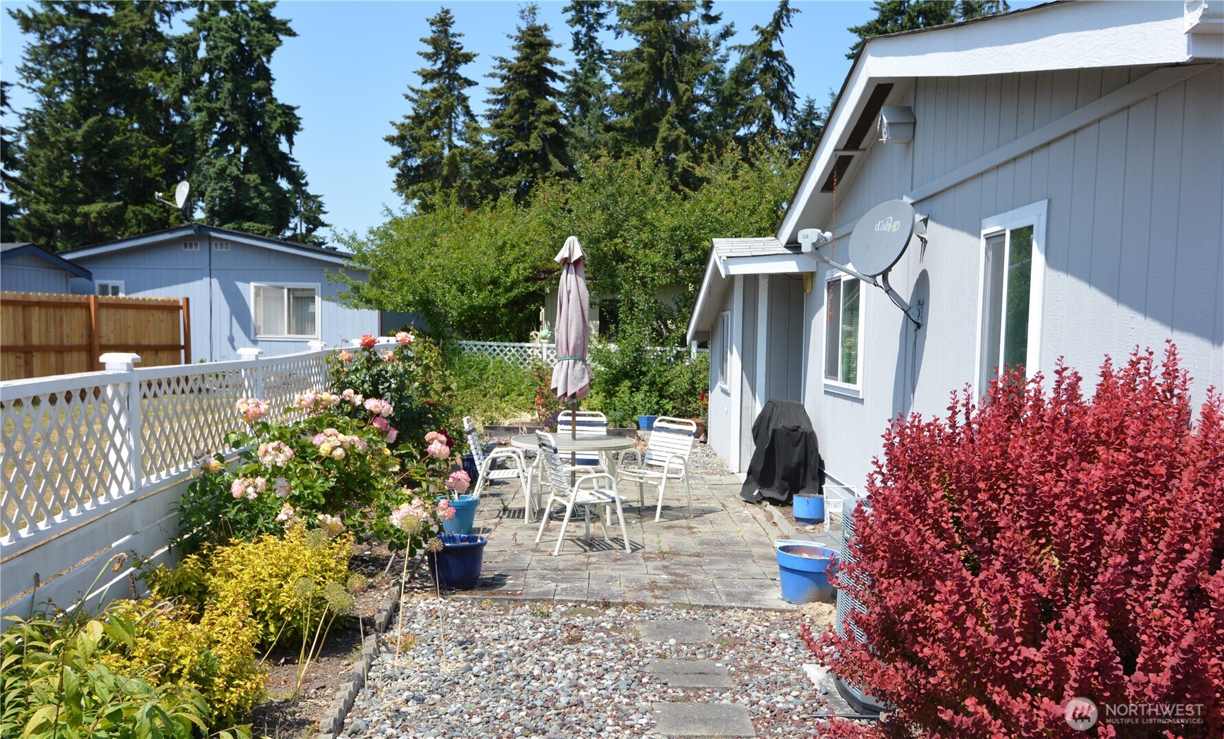 20 Brett Circle Sequim, WA 98382 - Photo 27 of 36 a view of a patio with table and chairs and potted plants