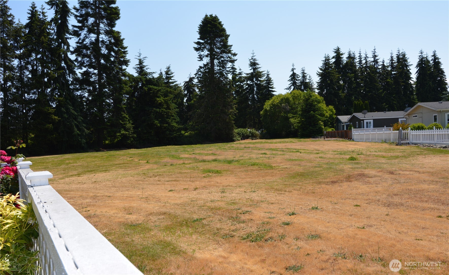 20 Brett Circle Sequim, WA 98382 - Photo 30 of 36 a swimming pool with trees in the background