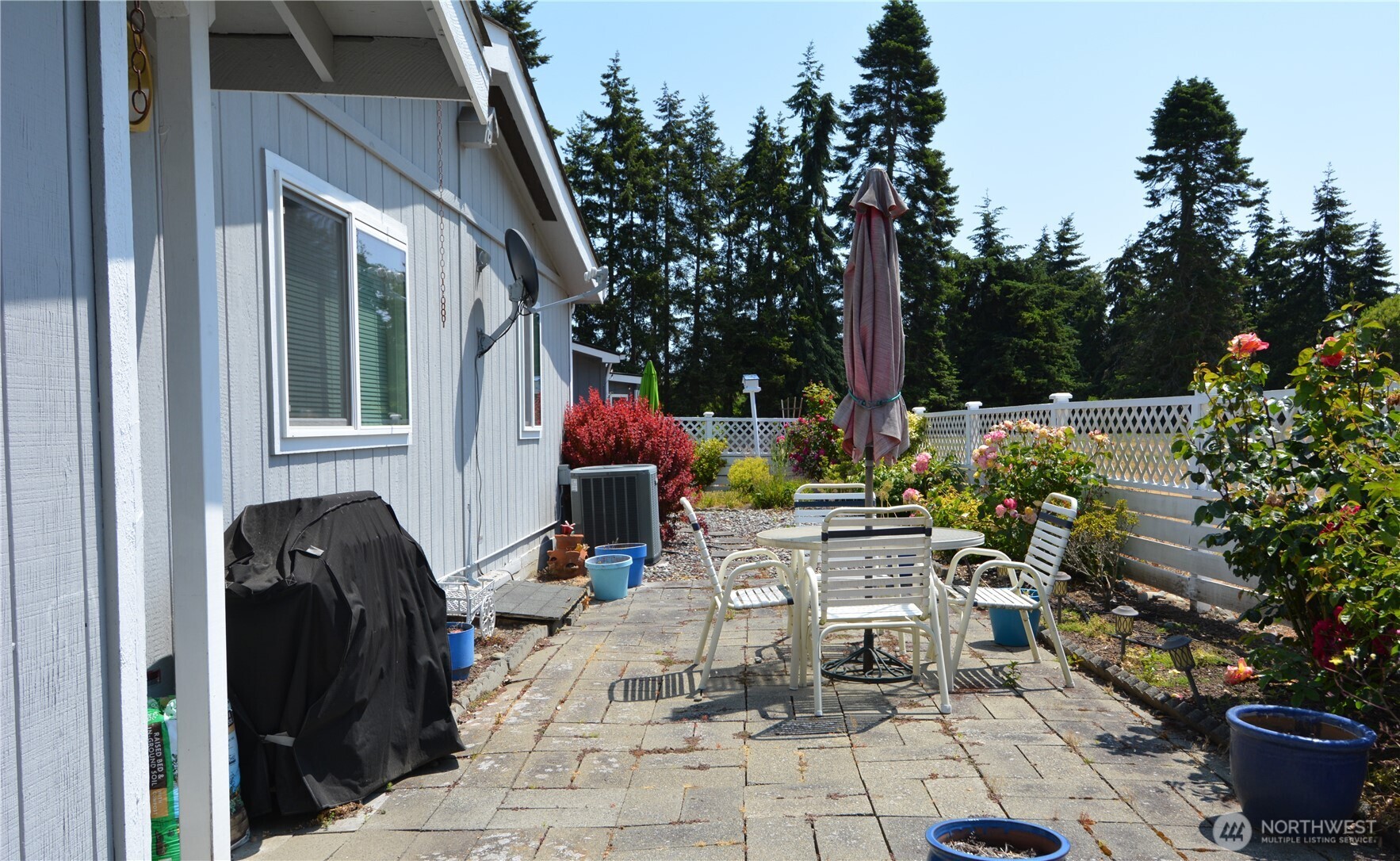 20 Brett Circle Sequim, WA 98382 - Photo 33 of 36 a view of backyard with outdoor seating and plants