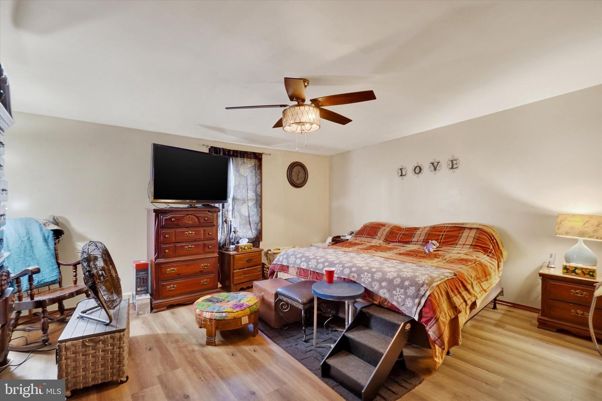 35 Kline Avenue Manchester, PA 17345 - Photo 12 of 28 a bedroom with a bed and a chandelier