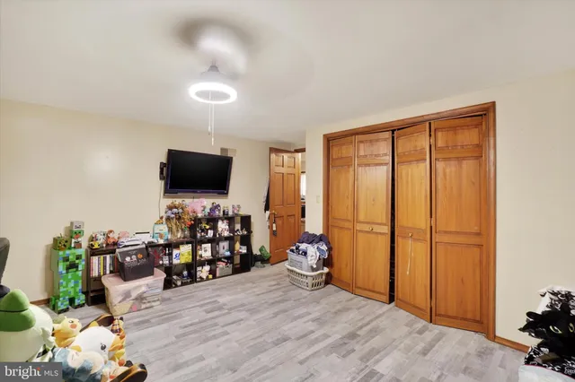 a view of a livingroom with furniture and a flat screen tv