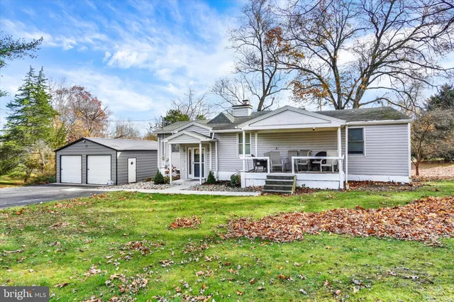 a house view with a sitting space and garden