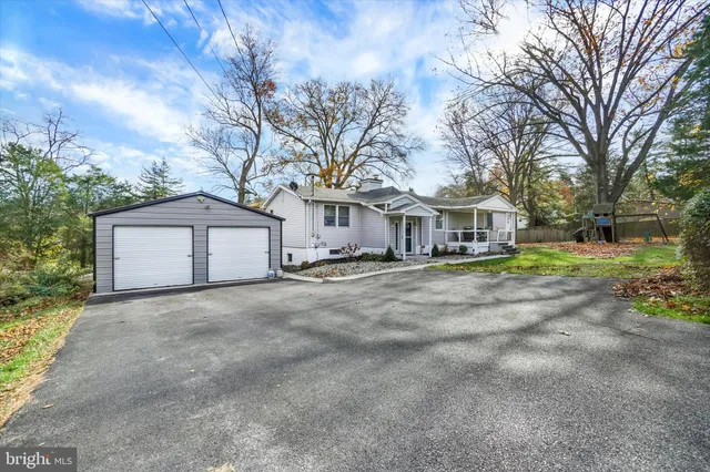 a view of large house with yard and road