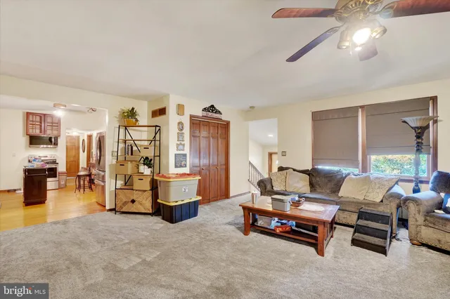 a living room with furniture and white walls