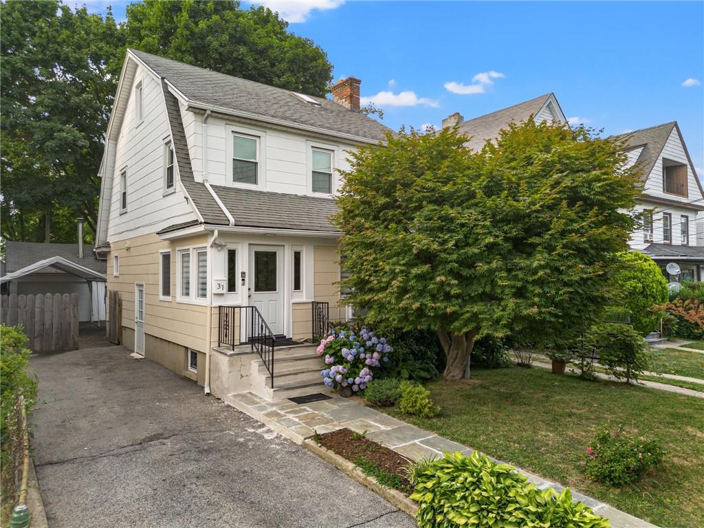 View of front of house with a front yard