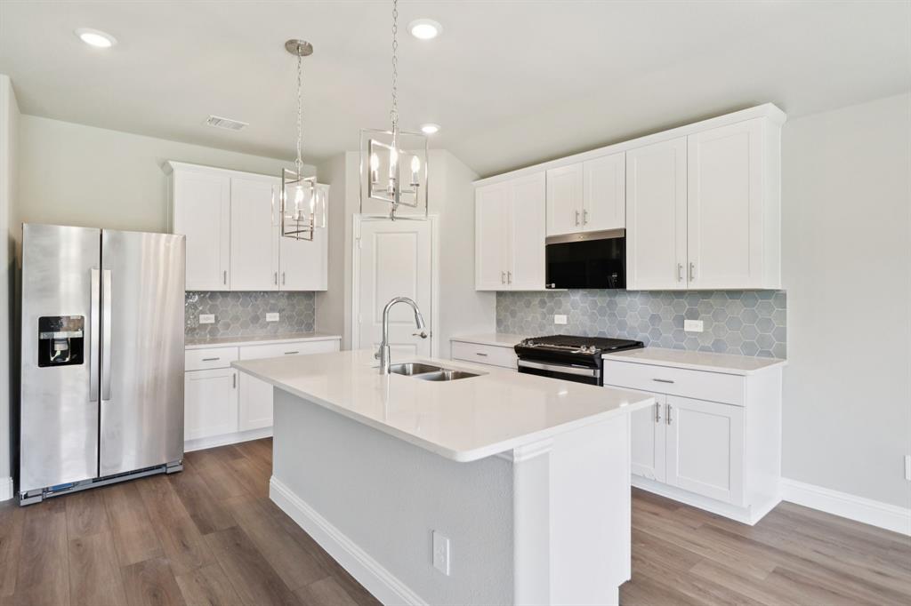 2101 Rannoch Street Sherman, TX 75092 - Photo 1 of 36 a kitchen with stainless steel appliances a sink stove and refrigerator