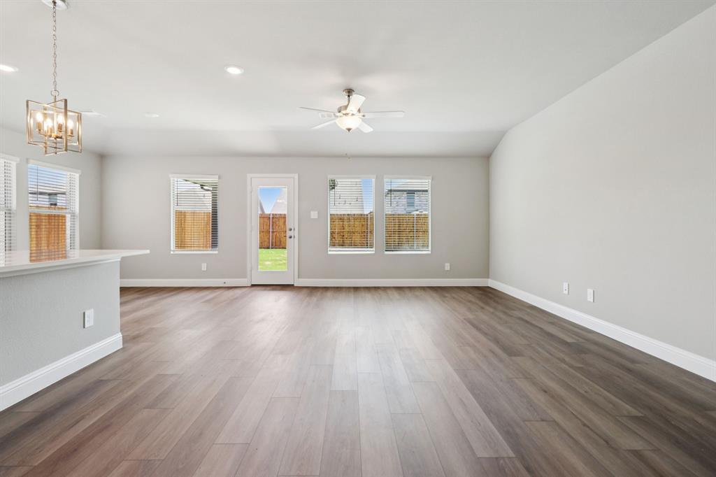 2101 Rannoch Street Sherman, TX 75092 - Photo 11 of 36 a view of an empty room with wooden floor and a window
