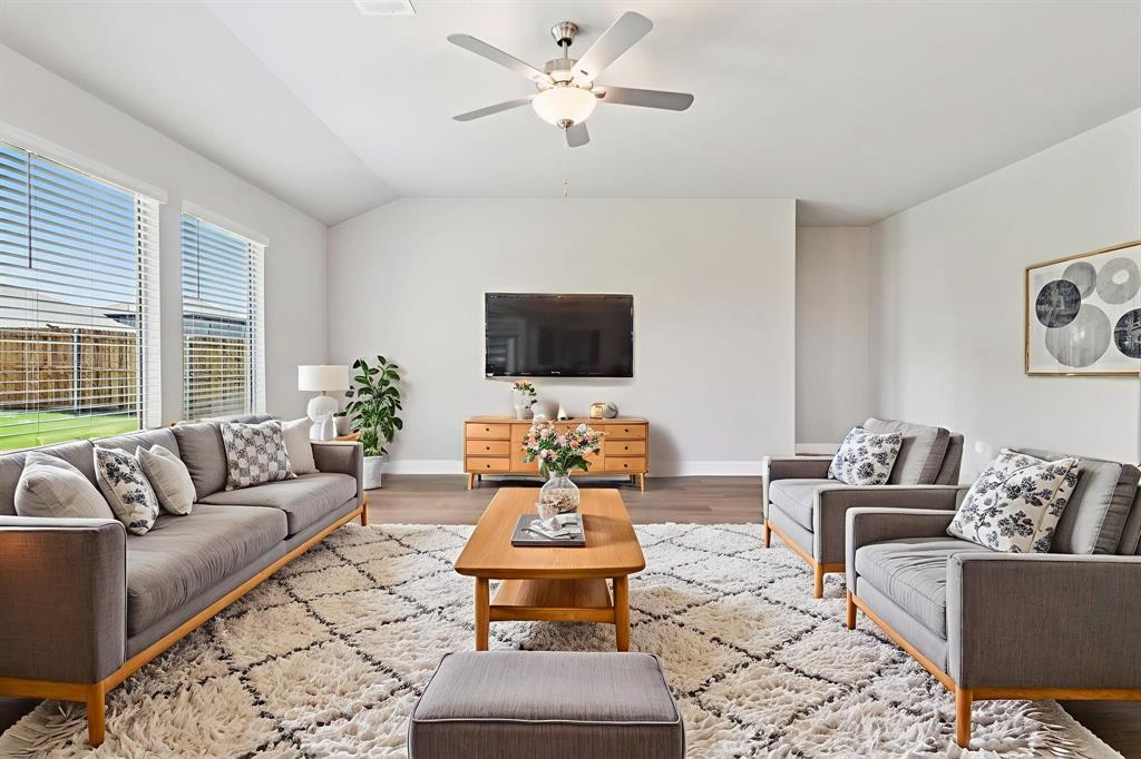 2101 Rannoch Street Sherman, TX 75092 - Photo 13 of 36 a living room with furniture and a flat screen tv