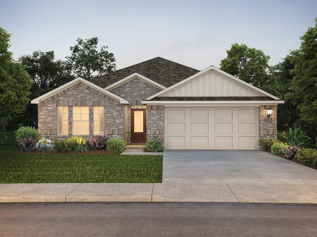 2101 Rannoch Street Sherman, TX 75092 - Photo 2 of 36 a front view of a house with a yard and garage
