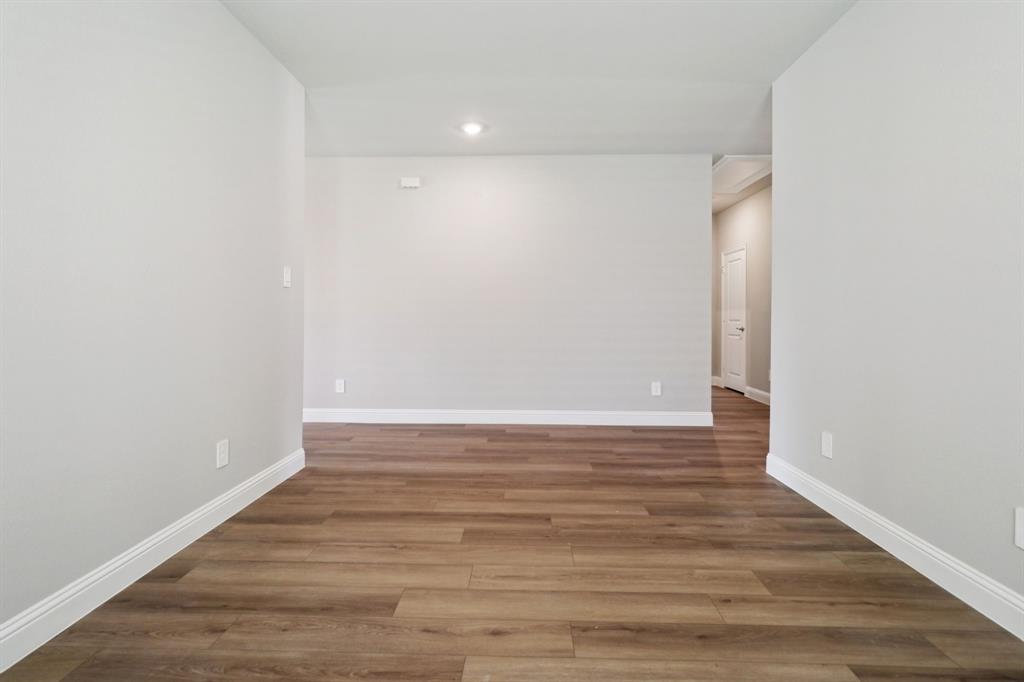 2101 Rannoch Street Sherman, TX 75092 - Photo 10 of 36 a view of an empty room with wooden floor