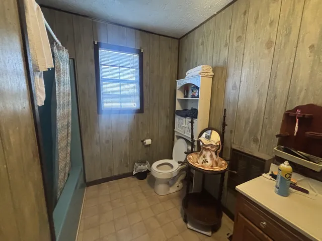 a bathroom with a toilet and a sink