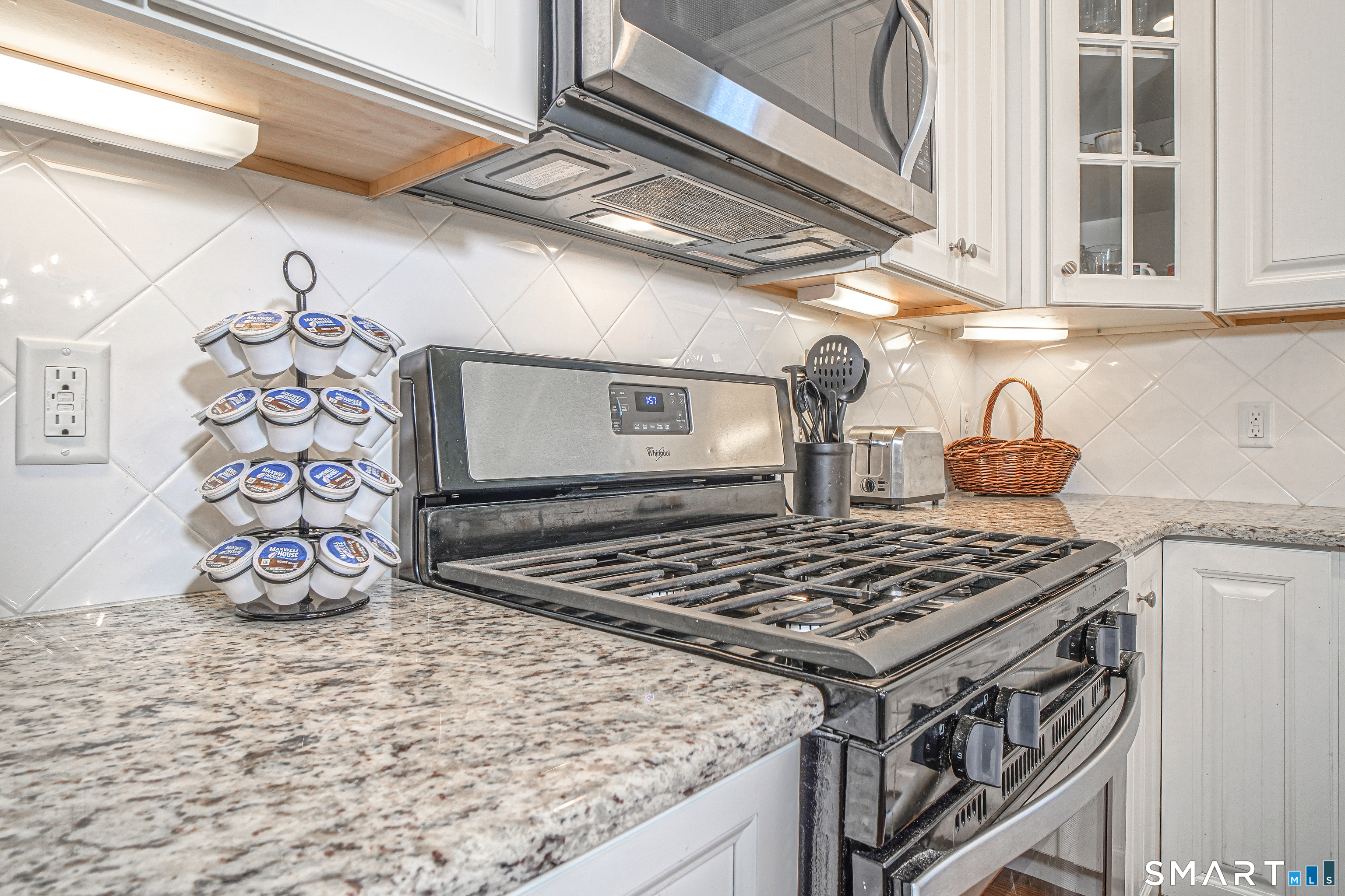 6 Lilac Lane, Unit 6 Prospect, CT 06712 - Photo 13 of 40 Under cabinet lighting, tiled backsplash set on the digital and granite countertops- ready to enjoy cooking.