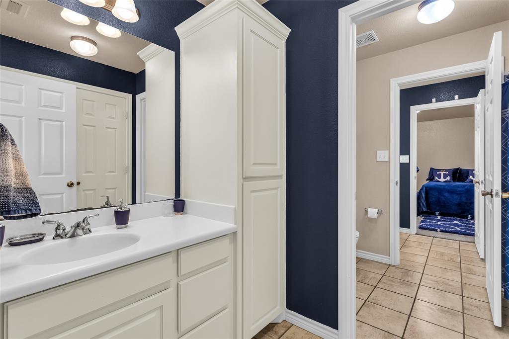 226 King George Road Ponder, TX 76259 - Photo 32 of 39 Bathroom featuring light tile patterned flooring and vanity