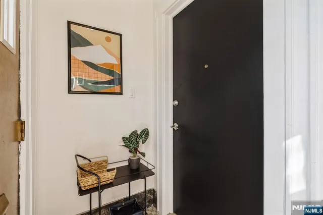 a view of room with furniture and wooden floor