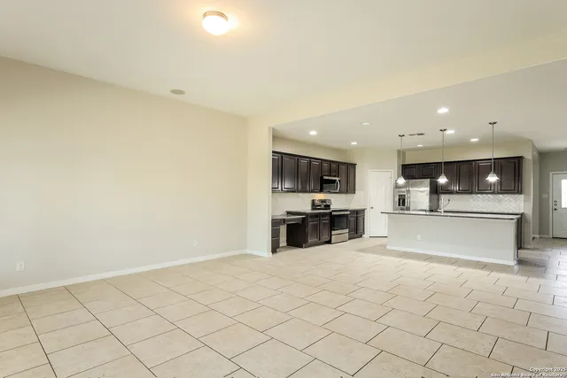 a view of kitchen with furniture and window