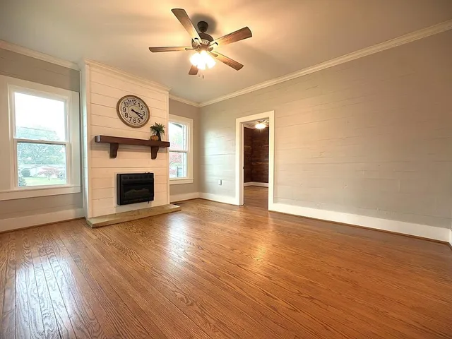 a front view of a house with a yard and table and chairs