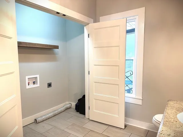 a bathroom with a double vanity sink and mirror