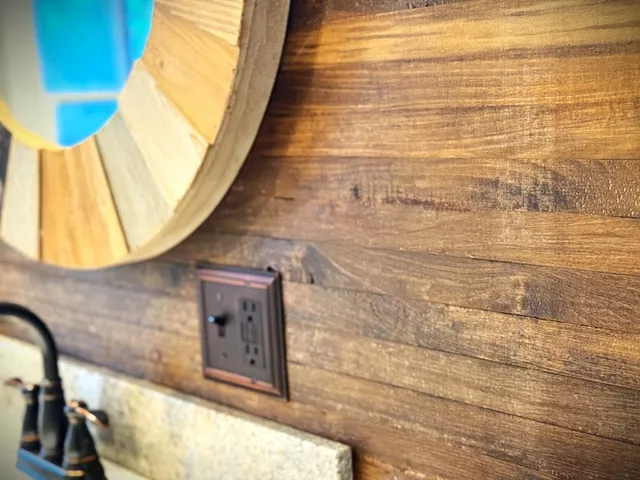 a room with water heater and wooden door