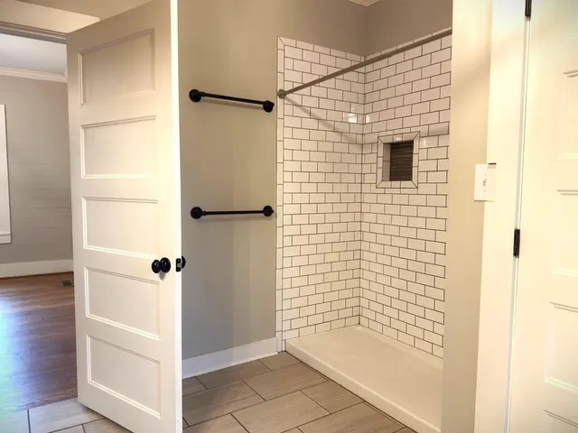 a kitchen with stainless steel appliances a refrigerator sink and cabinets