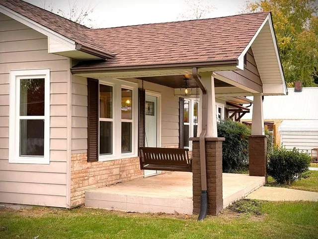 a front view of a house with a yard