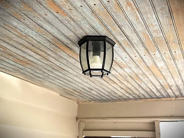 a bathroom with a granite countertop bathtub and toilet