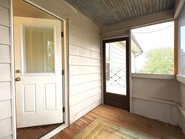 a bathroom with a sink a toilet a mirror and shower