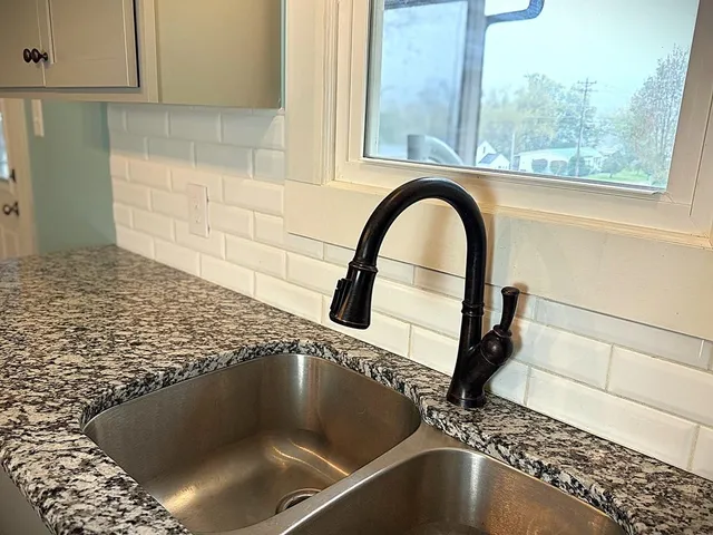 a bathroom with a sink a toilet and a bathtub