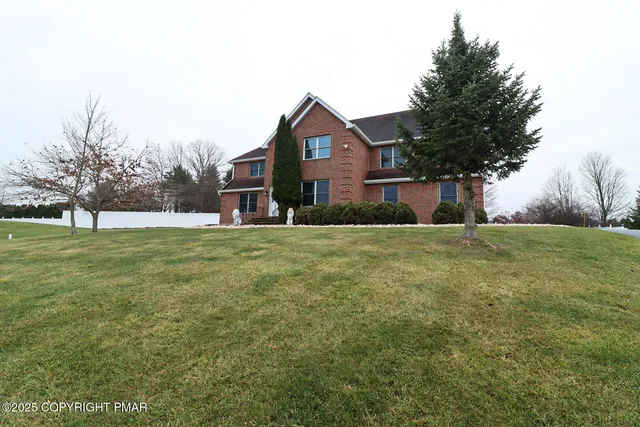 a house view with garden space