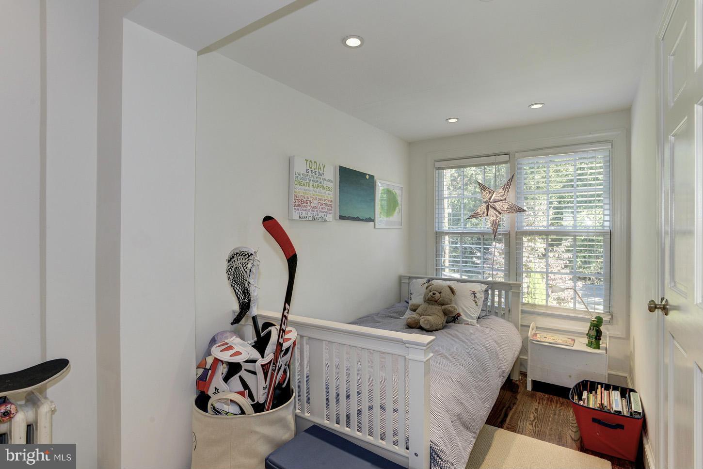 3813 T Street Northwest Washington, DC 20007 - Photo 15 of 24 a bed room with a bed and a window